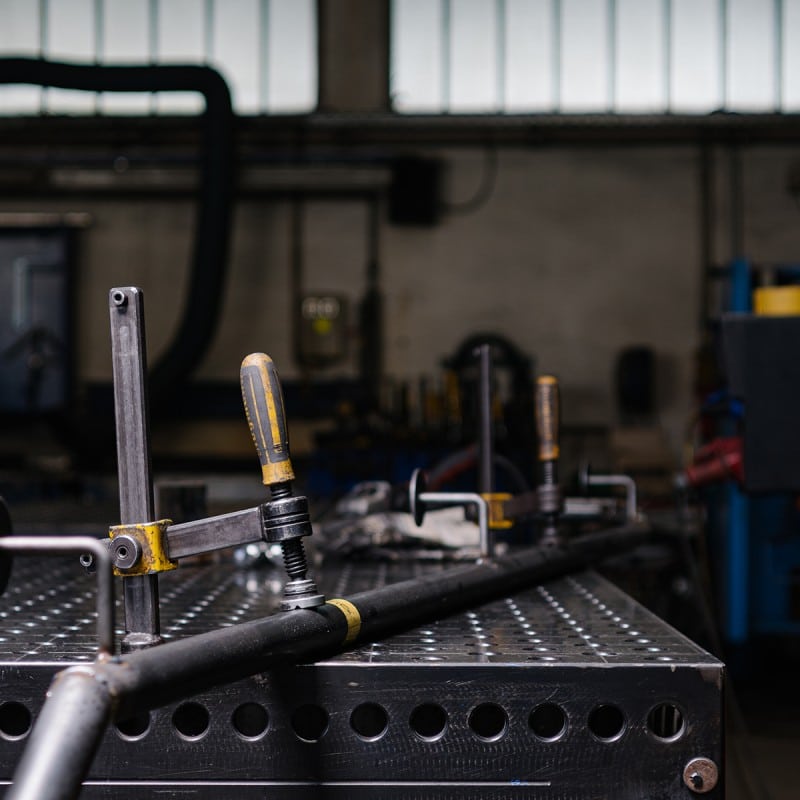 Steel pipe on a workbench in a workshop